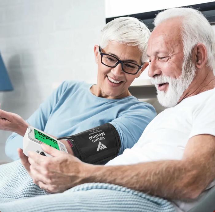 Couple checking blood pressure